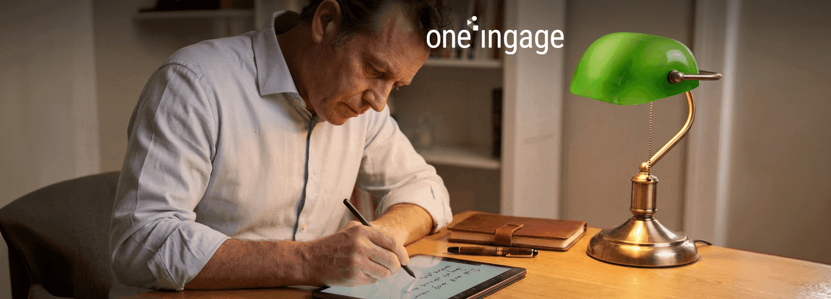 A professional workspace showing a laptop with digital marketing analytics and keyword data on the screen.